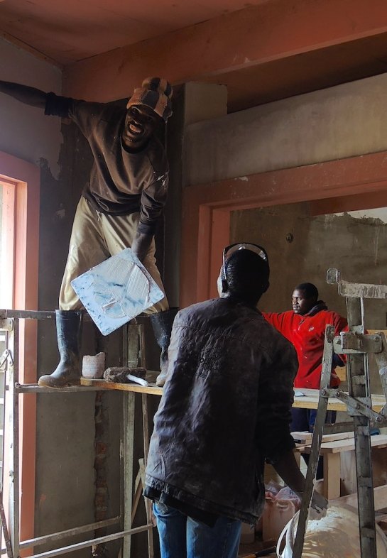 Mr Farai enjoys plastering in Rhinoset