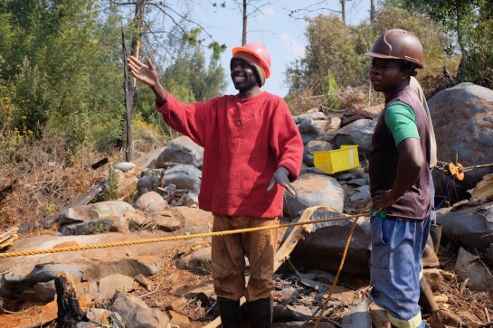 Get ready to chop the tree and crank the winch at the same time