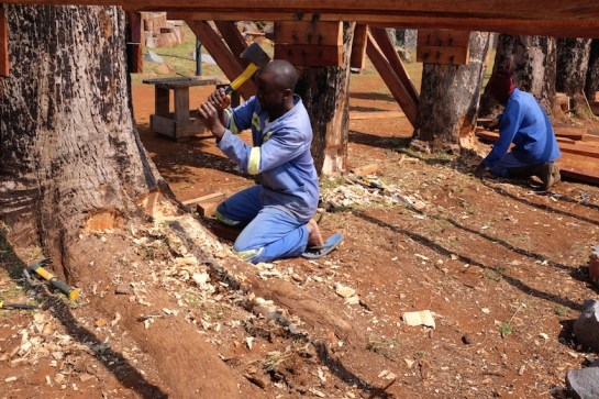 Tendai carving out holes for the long supporter beams