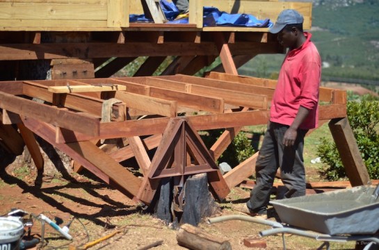 Metal cross inserted into hollowed out tree stump