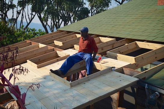 The roofing slats go on